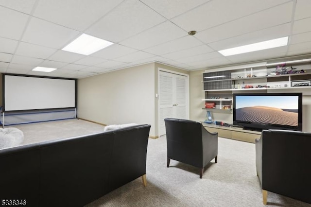 home office with a paneled ceiling and carpet floors