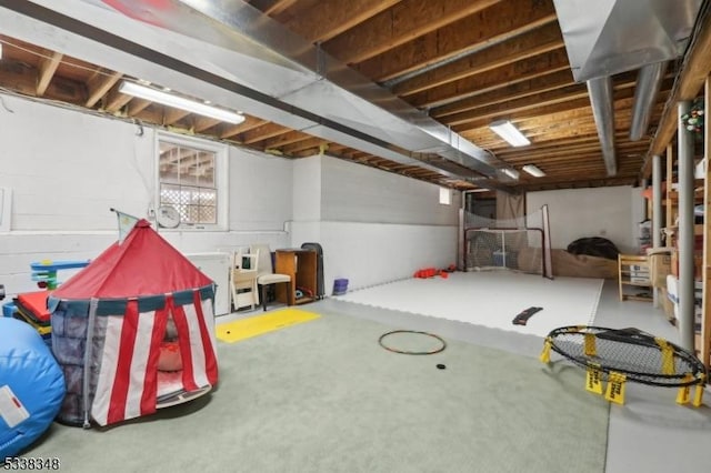 recreation room featuring concrete flooring