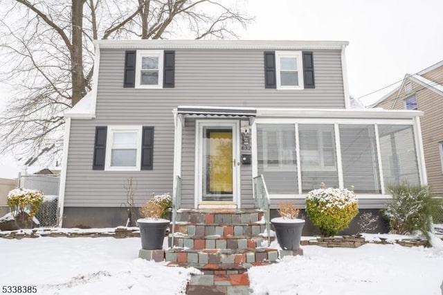 view of front property with a sunroom