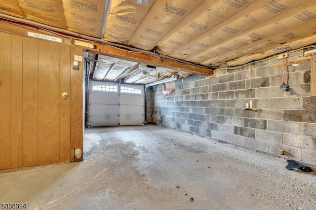 garage featuring concrete block wall