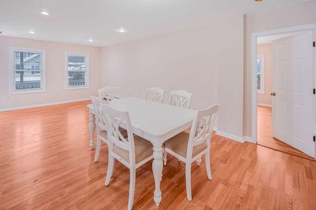 dining room featuring recessed lighting, baseboards, and light wood-style floors