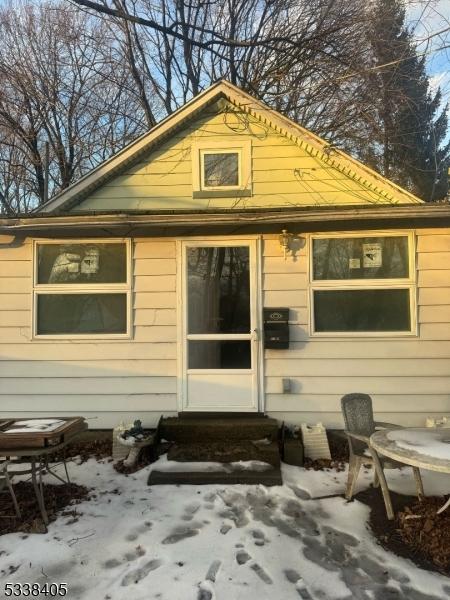 view of snow covered house