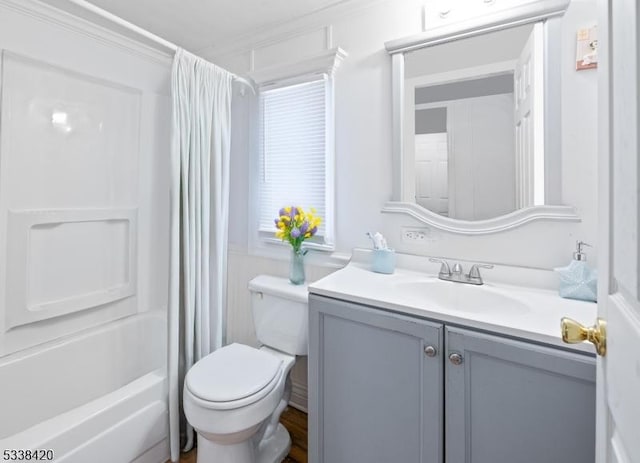 full bathroom featuring toilet, shower / bath combination with curtain, and vanity