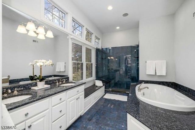 bathroom featuring vanity and a shower with door