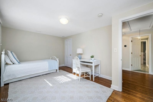 bedroom with hardwood / wood-style floors