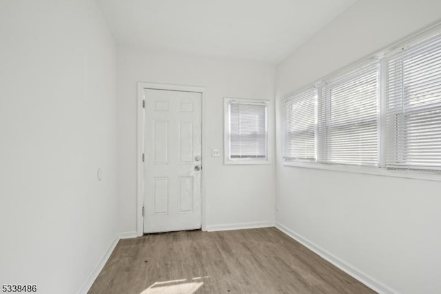 unfurnished room with light wood-type flooring