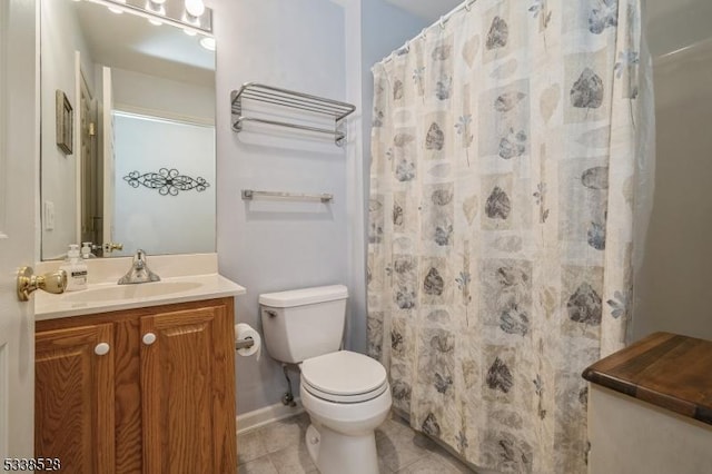 bathroom featuring toilet, curtained shower, tile patterned flooring, and vanity