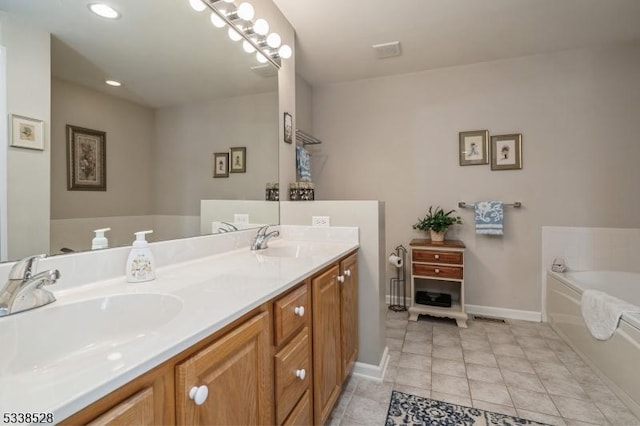 full bathroom with tile patterned flooring, a garden tub, a sink, and double vanity