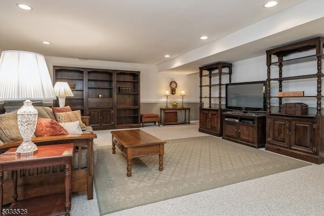 living area featuring carpet floors and recessed lighting