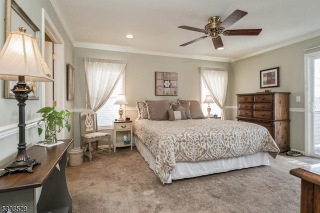 bedroom featuring carpet floors, multiple windows, baseboards, and crown molding