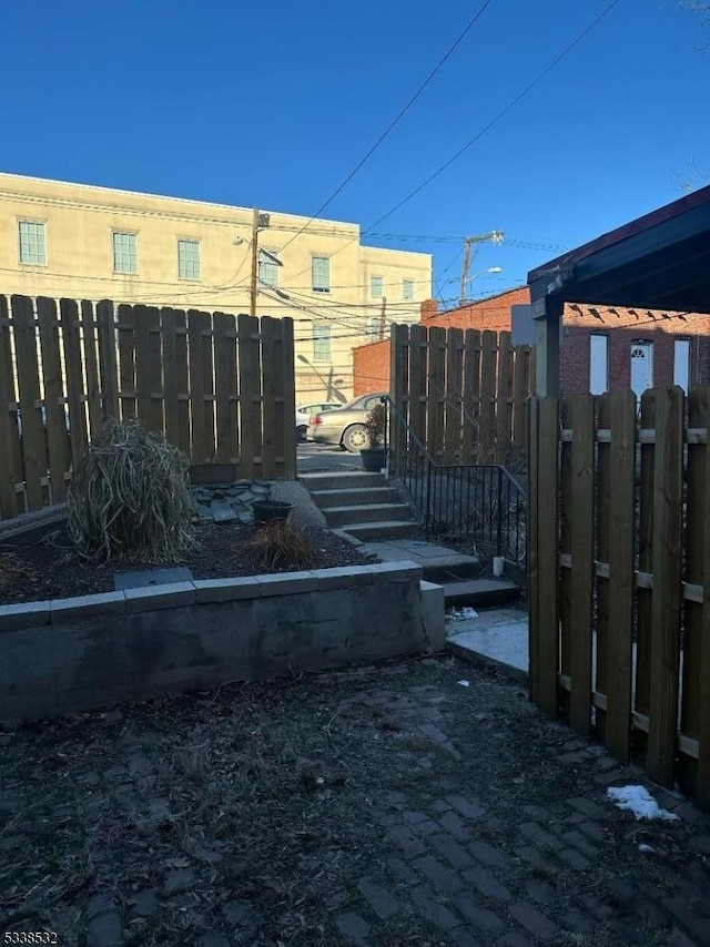 view of gate featuring fence