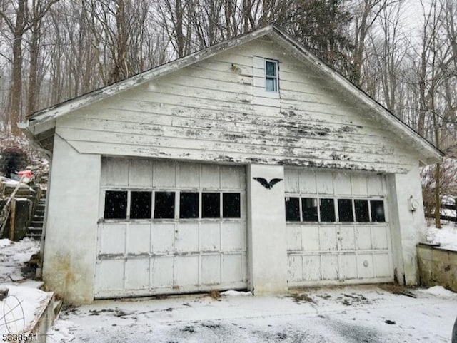 view of snow covered garage