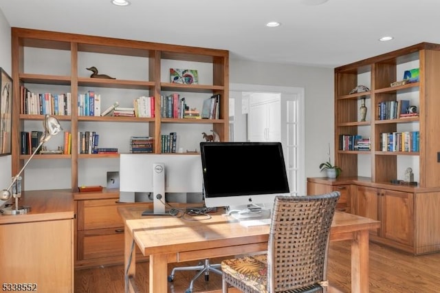 office space with light hardwood / wood-style flooring