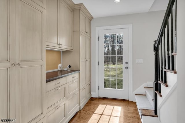 doorway with light hardwood / wood-style flooring