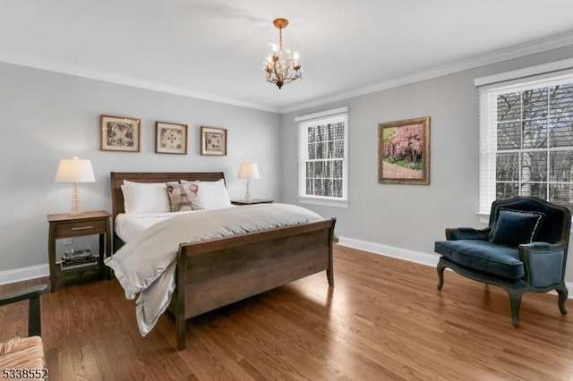 bedroom featuring crown molding, an inviting chandelier, and wood-type flooring