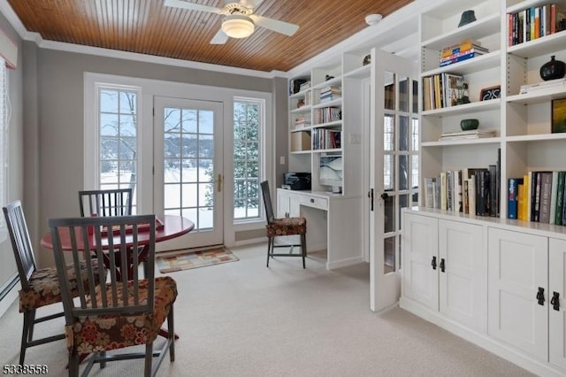 sitting room with light carpet, ceiling fan, wooden ceiling, and crown molding