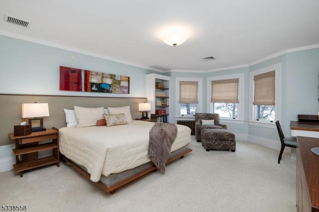 carpeted bedroom featuring baseboards, visible vents, crown molding, and radiator heating unit