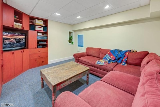 living area with built in features, baseboards, carpet flooring, and recessed lighting