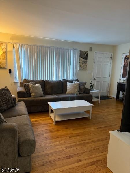 living room with plenty of natural light and light wood-style flooring