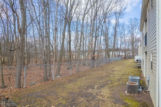 view of yard with central AC unit