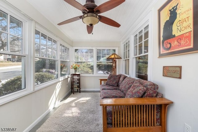 sunroom / solarium with a ceiling fan