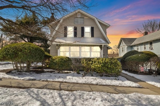 colonial inspired home with a gambrel roof