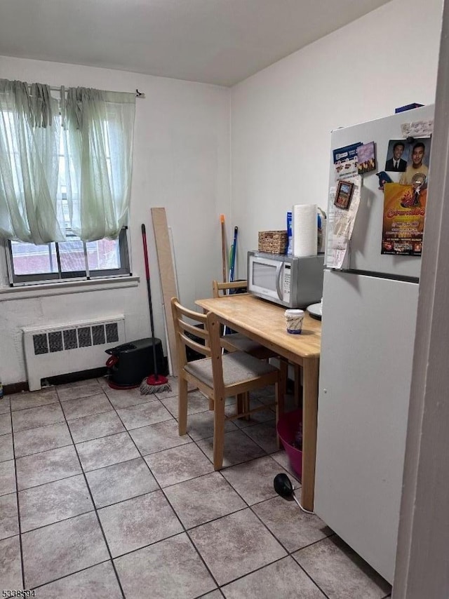 tiled office featuring radiator