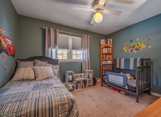 carpeted bedroom with ceiling fan