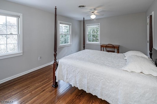 bedroom with ceiling fan and dark wood-type flooring