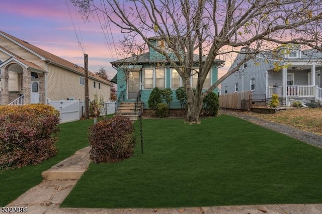 view of yard at dusk