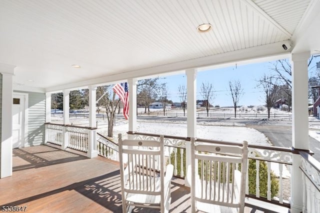 view of snow covered deck