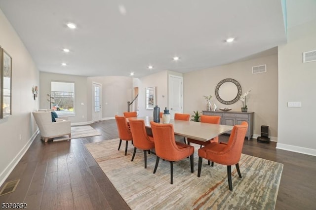 dining area featuring dark wood-type flooring, recessed lighting, visible vents, and baseboards