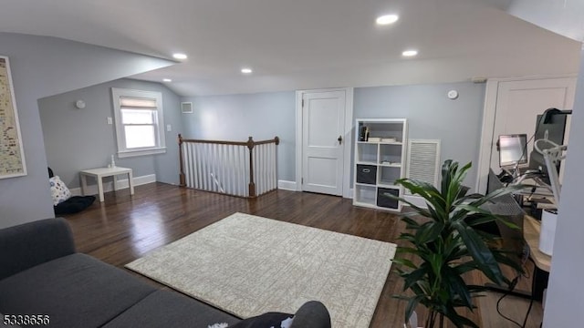 living area featuring lofted ceiling, baseboards, recessed lighting, and wood finished floors