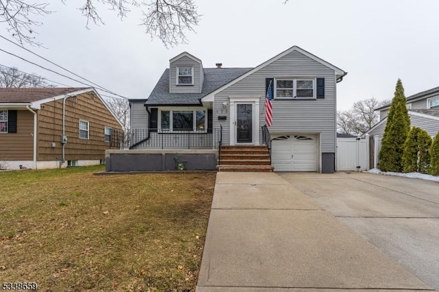 view of front of home with a garage and a front yard