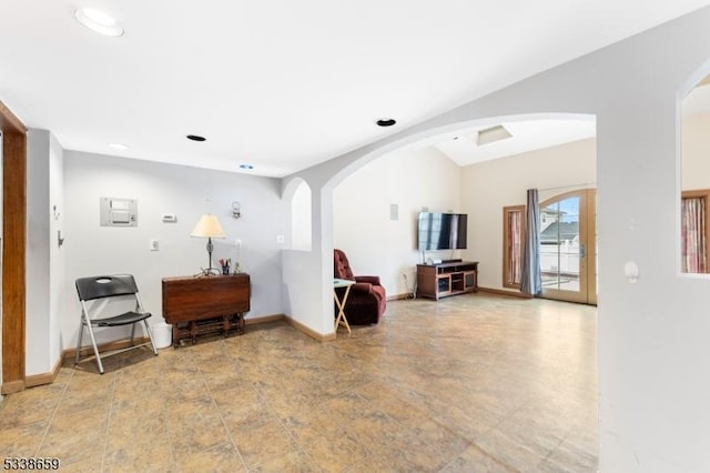 living room featuring vaulted ceiling