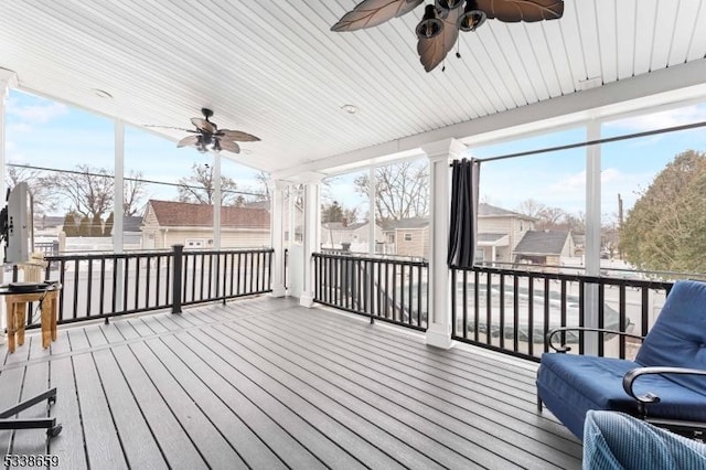 wooden terrace featuring ceiling fan