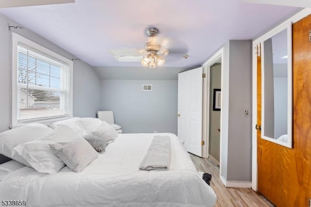 bedroom with light hardwood / wood-style flooring and ceiling fan