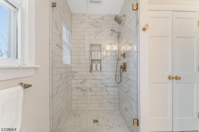 full bath with a shower stall