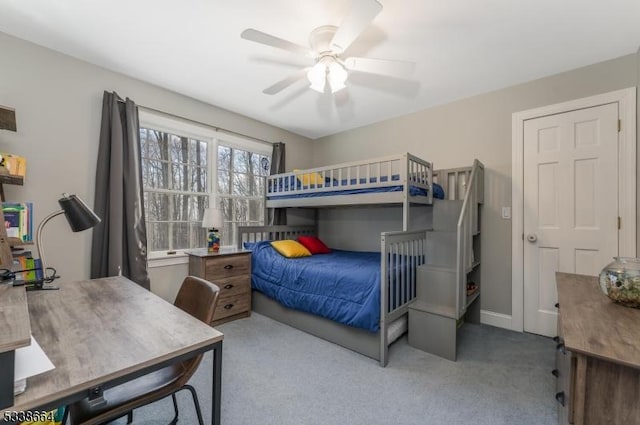 bedroom featuring carpet floors, baseboards, and a ceiling fan