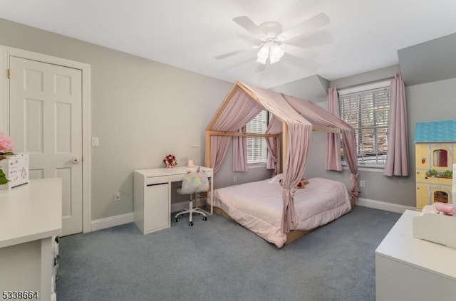 carpeted bedroom with ceiling fan, multiple windows, and baseboards