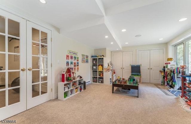 recreation room featuring recessed lighting, carpet flooring, and french doors