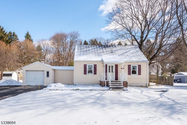 view of front of home featuring an outbuilding and a garage