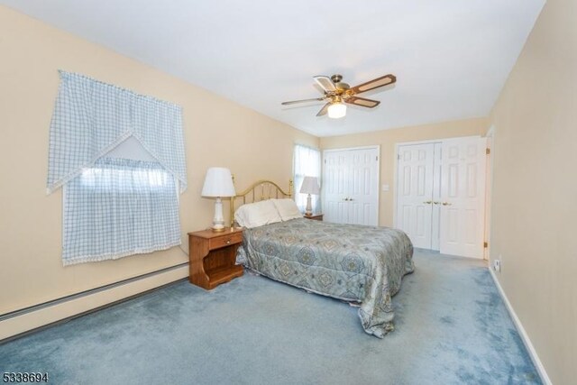 345 Center Grove Rd, Randolph Twp, NJ 07869 - carpeted bedroom featuring ceiling fan, multiple closets, and a baseboard heating unit