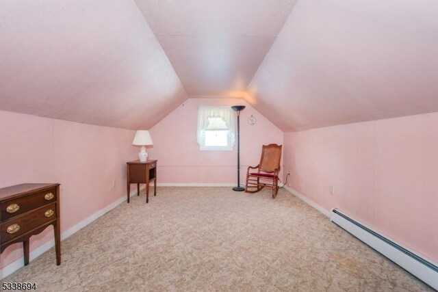 345 Center Grove Rd, Randolph Twp, NJ 07869 - interior space featuring vaulted ceiling, light colored carpet, and a baseboard radiator