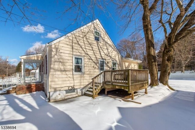 345 Center Grove Rd, Randolph Twp, NJ 07869 - snow covered house featuring a deck