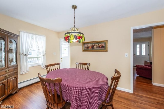 345 Center Grove Rd, Randolph Twp, NJ 07869 - dining space featuring a baseboard radiator and hardwood / wood-style floors