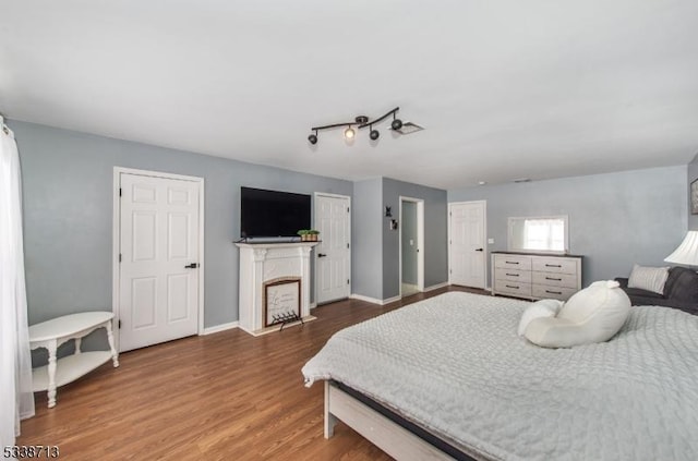 bedroom with hardwood / wood-style flooring