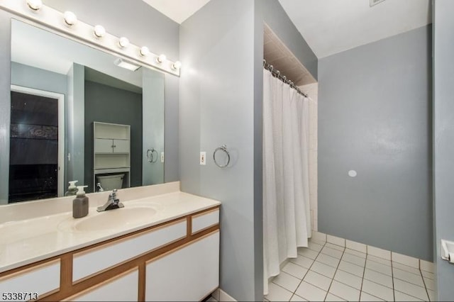 bathroom featuring tile patterned flooring and vanity