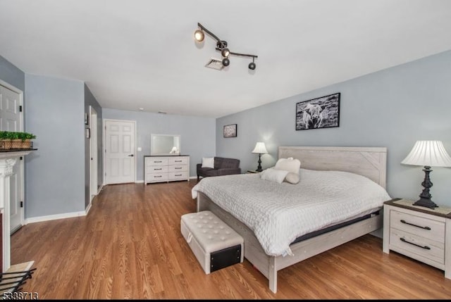 bedroom with light hardwood / wood-style floors