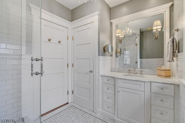 bathroom featuring tile walls and vanity